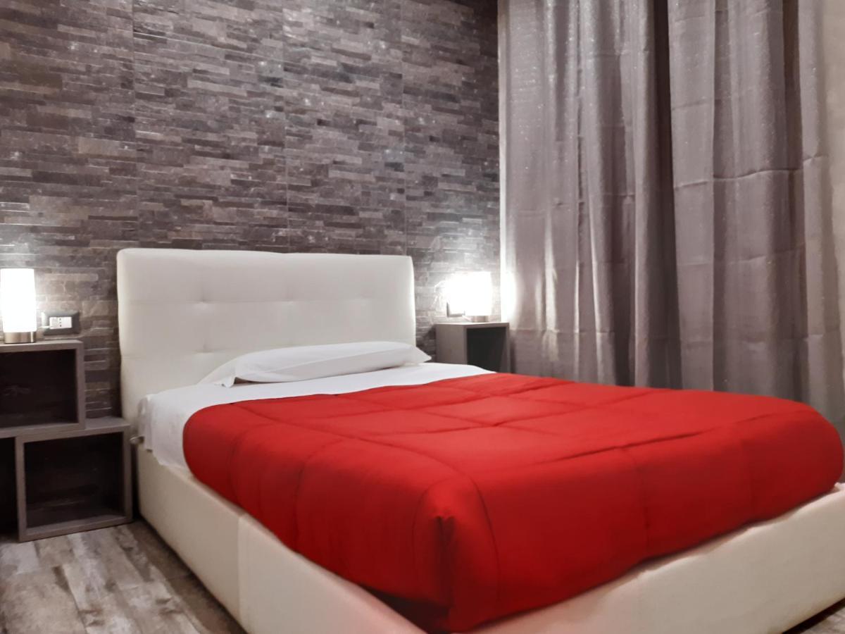 Apple Rooms Rome Airport Fiumicino Exterior foto A bed with a duvet